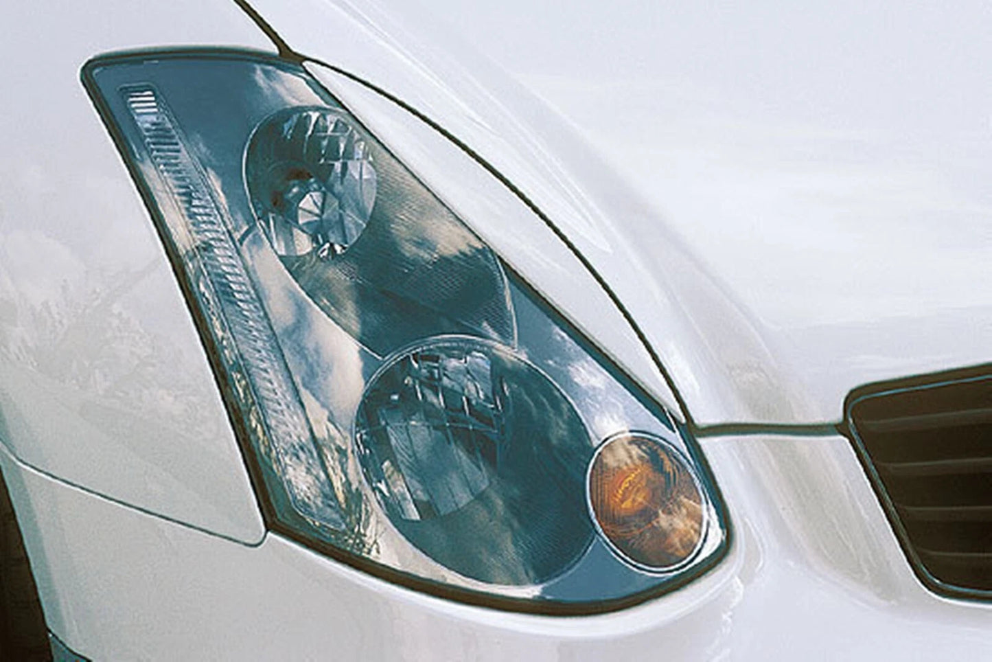 2 x Carbon Fiber Headlight Eyelid Trim for Infiniti G35 V35 (2002-2006)