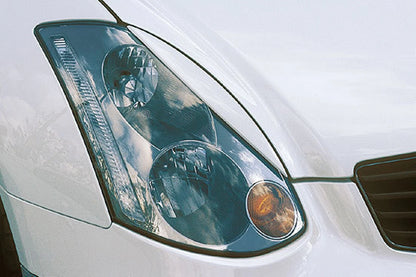 2 x Carbon Fiber Headlight Eyelid Trim for Infiniti G35 V35 (2002-2006)